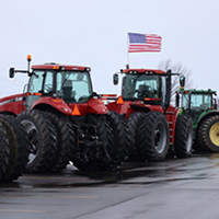 The American flag on top of tractors