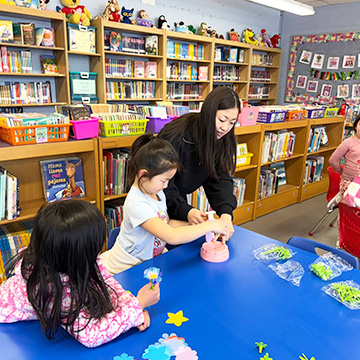View of the running track field Teacher and students making flower gifts