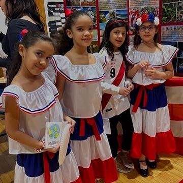 Four girls in traditional Hispanics dresses