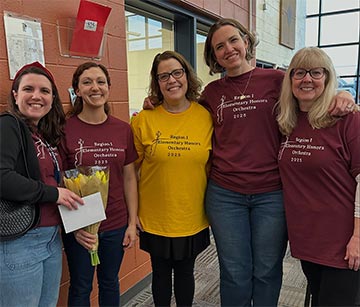 Staff members in orchestra group shirts Staff members in orchestra group shirts