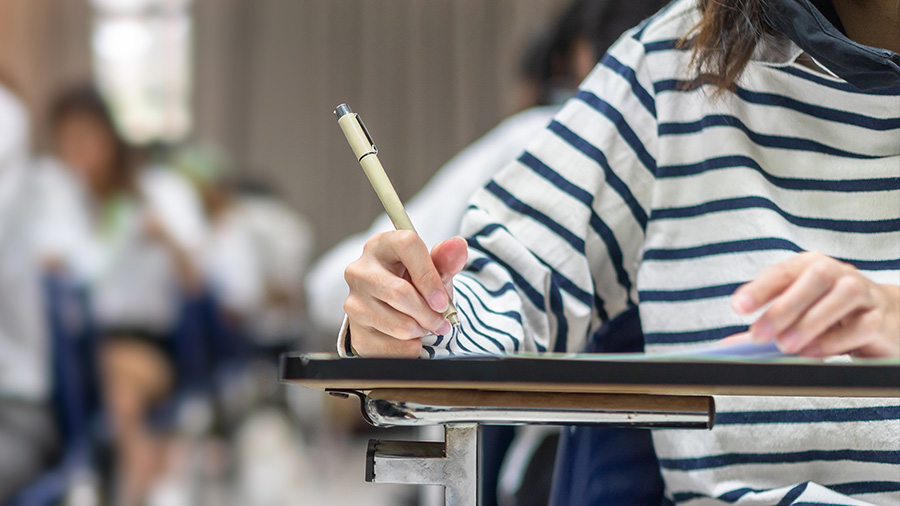 High school student taking an exam in the classroom