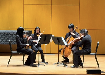 Band members playing on stage