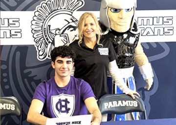 Nick signing his letter of intent to Dive at the College of The Holy Cross