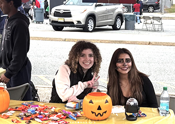 Students hosting a candy table for Trunk-n-Treat event