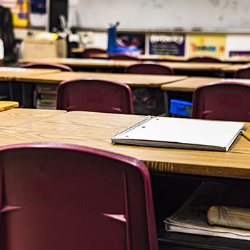 Notebook on desk in the classroom Notebook on desk in the classroom