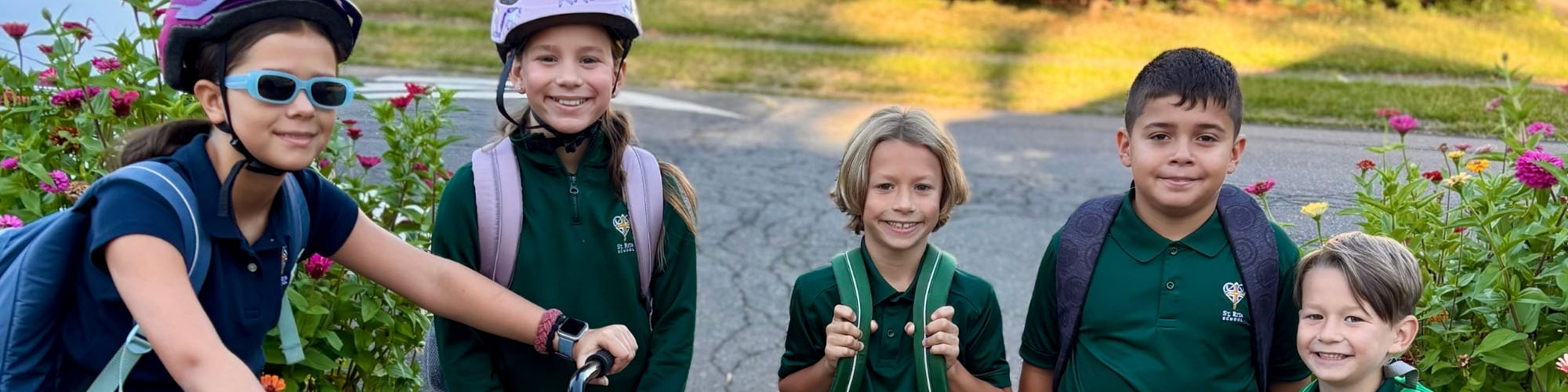 Group of happy students, some wearing biking helmets