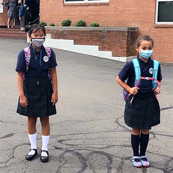 Two students walking to school
