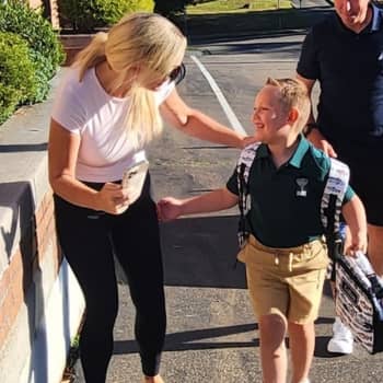 Two students sitting on stairs