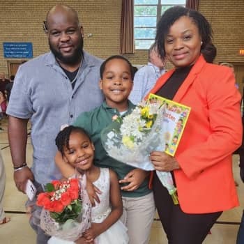 Two students holding hands
