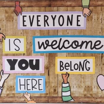 Two students smiling