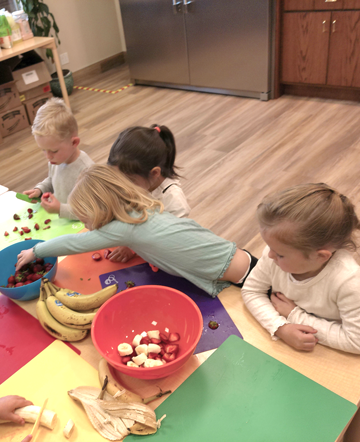 Children making art with food