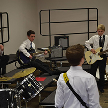 Students playing musical instruments