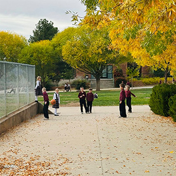 students playing in the yard