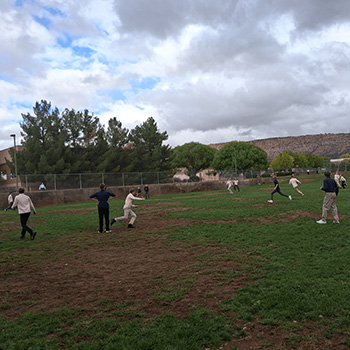 Students playing ball in a field