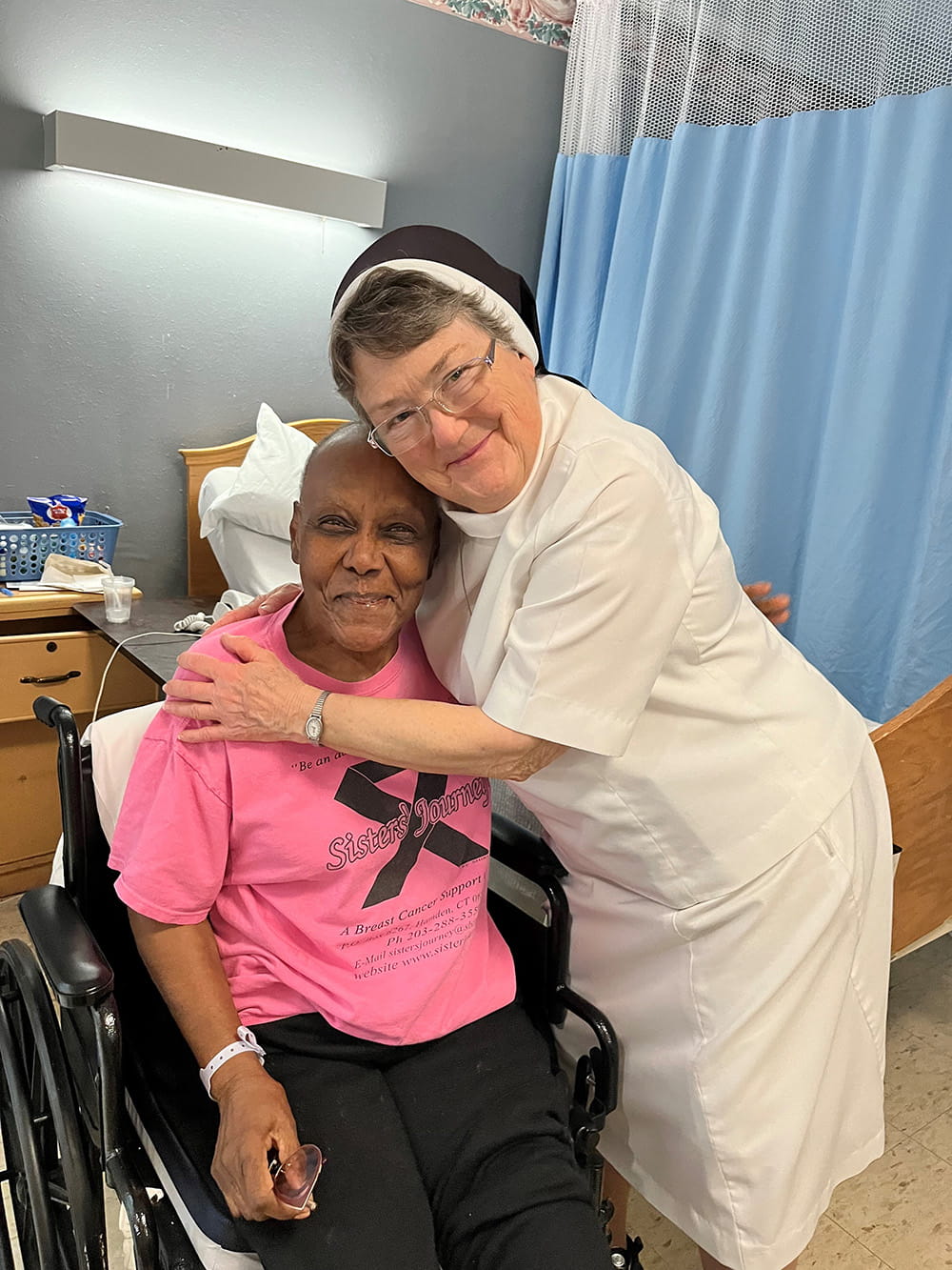 Sister hugging a woman in the hospital
