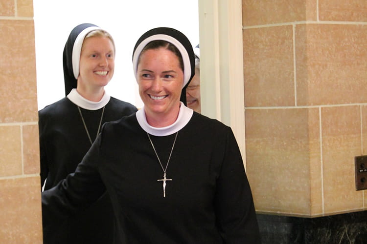 Sisters walking into Mass