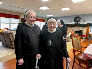 Two happy sisters smiling for the camera