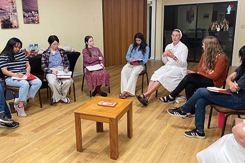 A Sister with ladies having a Bible study