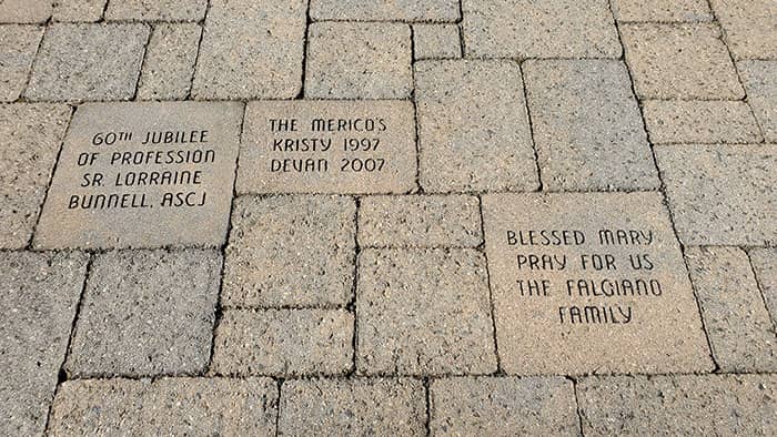 Engraved paver messages on the pathway