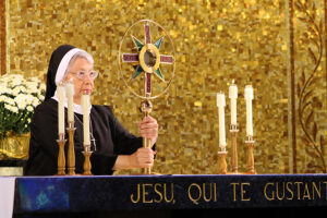 Sister standing in the front at exposition