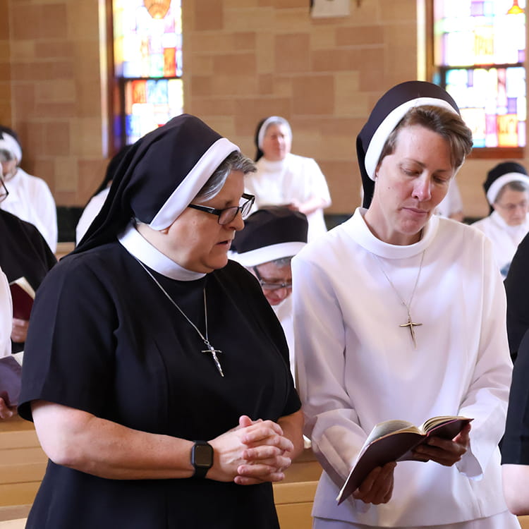 Two sisters standing together after convent