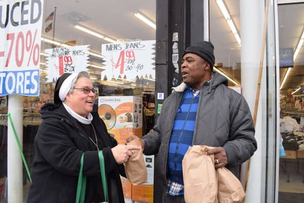 A sister talking with a man outside a store