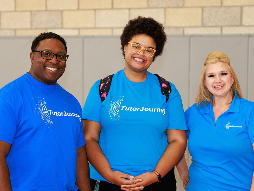 three tutors smiling