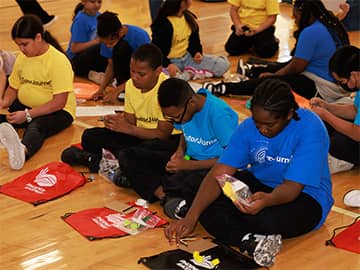 Students looking through swag bags