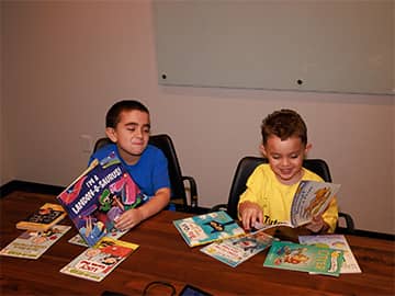Two students reading together