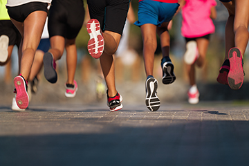 Students running down a road