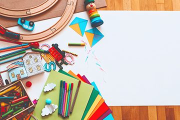 Colorful school supplies and toys on a table