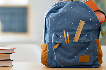 Blue backpack on a desk