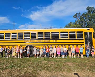 Students in front of a school bus
