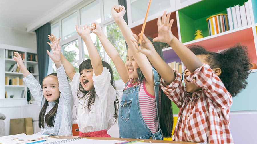 Preschoolers cheering in class