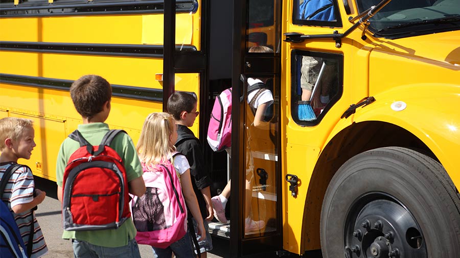 Students getting on the bus
