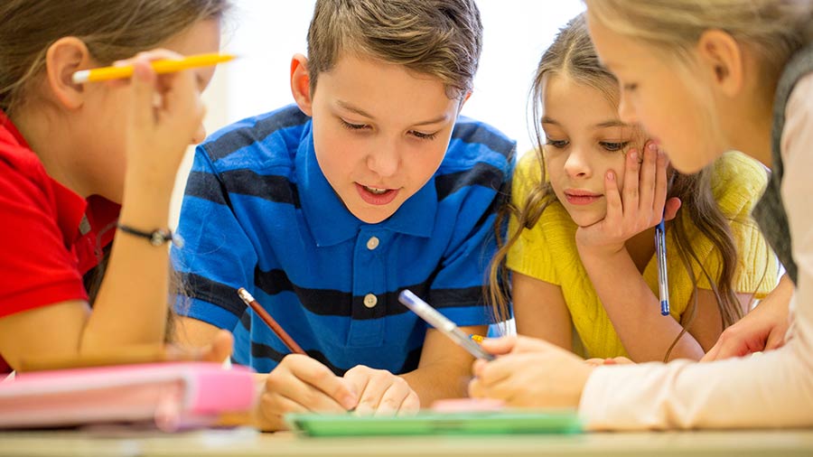 Students doing an assignment together at a desk