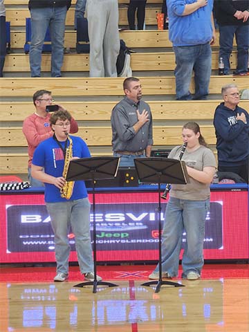 two students performing instruments