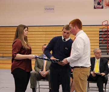 Student folding a flag