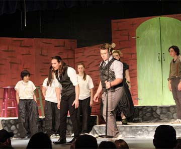 Students on stage performing