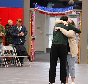 Student hugging his mom