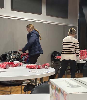 Students wrapping presents