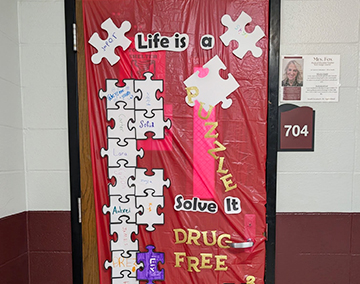 Classroom door decorated with life is a puzzle