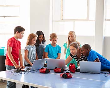 Students gathered around computers
