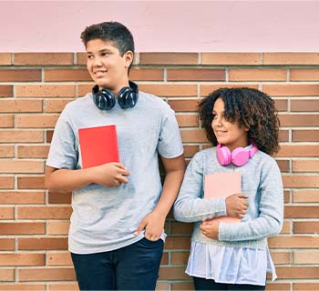 Two students standing next to eachother