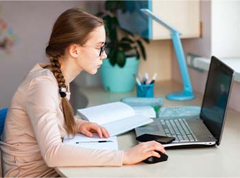 student working on a laptop