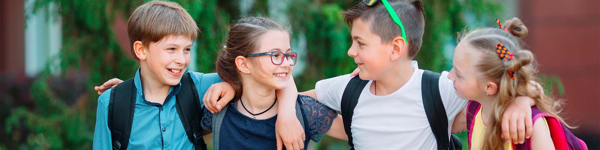 Four students walking together