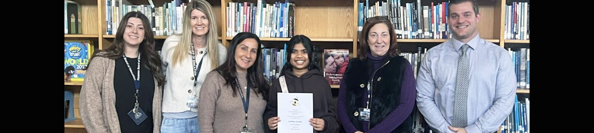 West Brook's Spelling Bee champion, 7th Grader Advithaa with staff memers