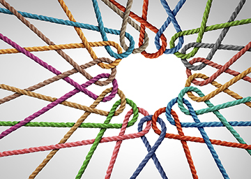 Colorful strings in the shape of a heart representing unity