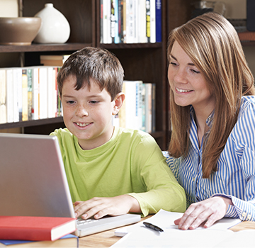 Mom helping son with a homework assignment