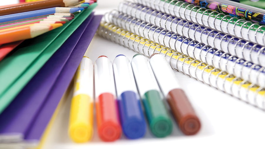 Notebooks, colored pencils and markers, folders